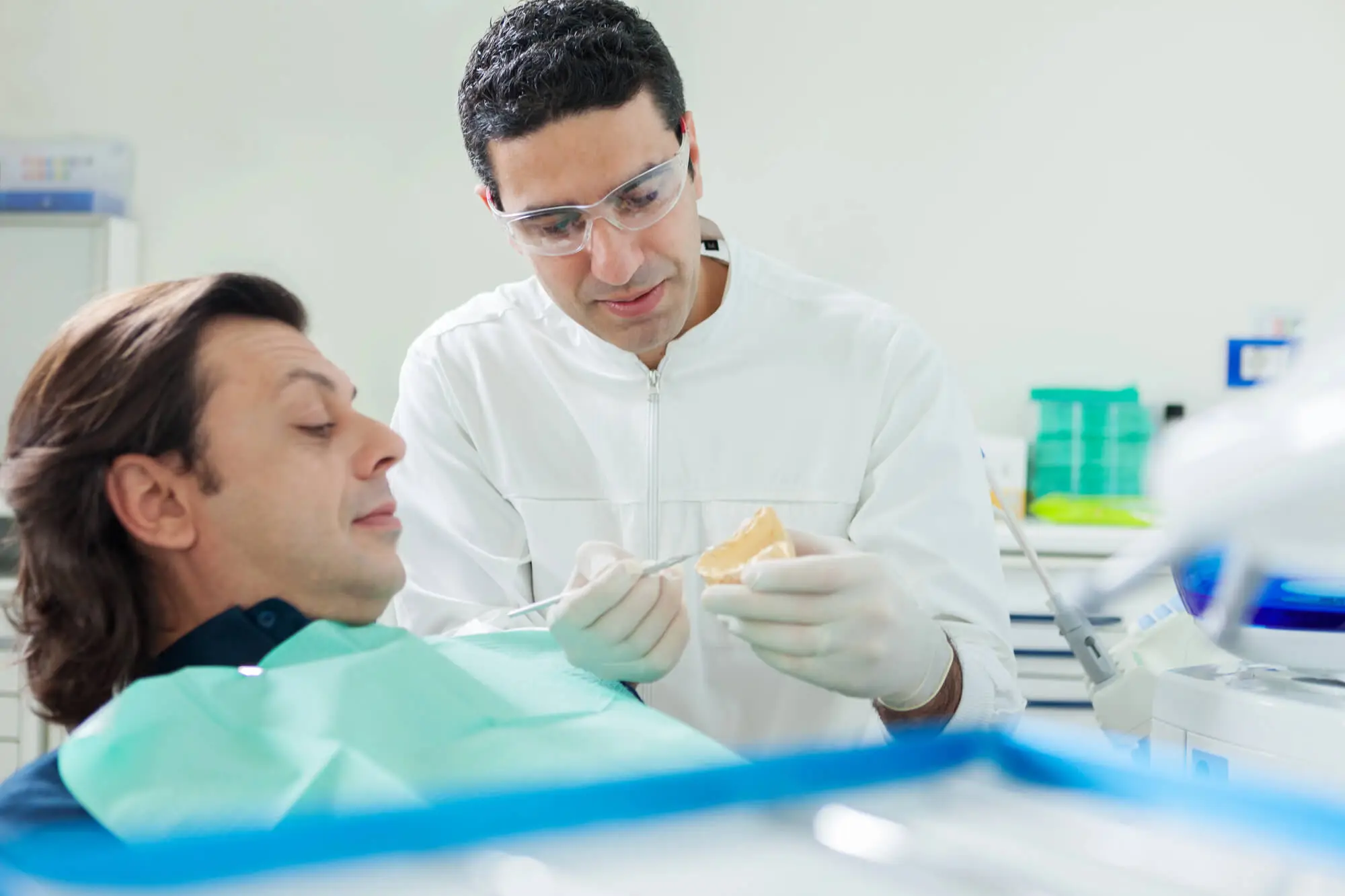 Man Learning the Long-Term Cost Savings of Dental Implants in Concord